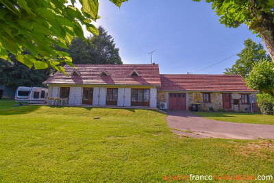 Bungalow with outbuildings and a mature park
