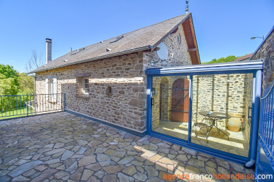 Two houses with a wooded park