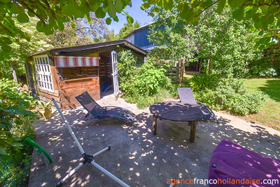 Two houses with a wooded park