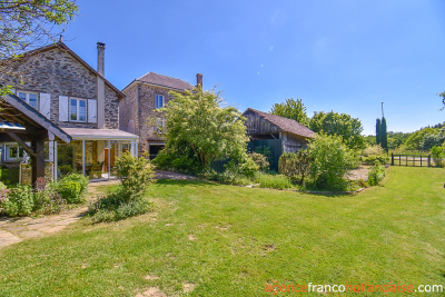 Two houses with a wooded park