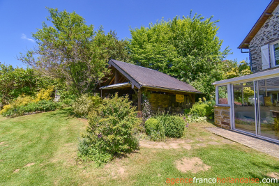 Two houses with a wooded park