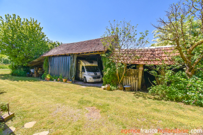 Two houses with a wooded park