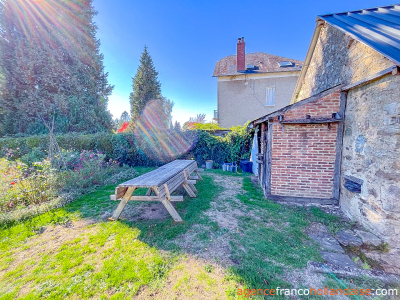Village stone house with barn and land