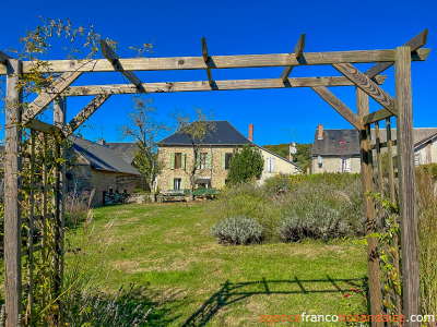 Village stone house with barn and land
