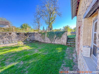 Village stone house with barn and land