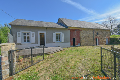 Village farmhouse with barns and ¾ acre